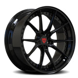 Black alloy wheel with a visible brand logo on a white background