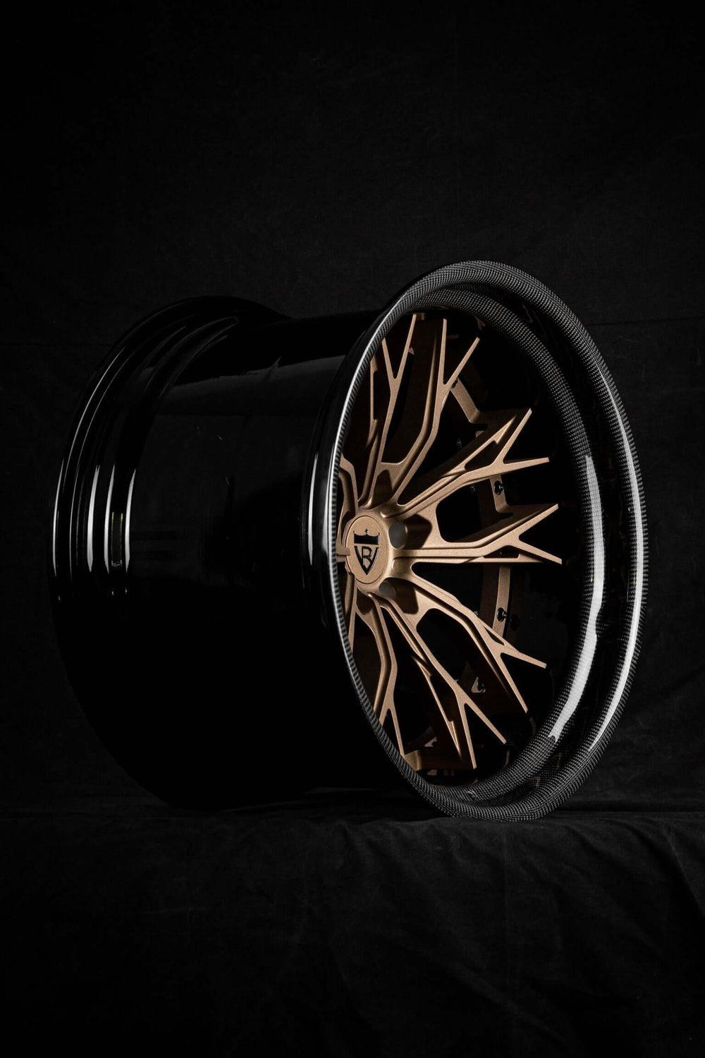 Custom forged step lip wheel with a deep dish design, ideal for Corvette C8 enthusiasts. Black finish with gold accents.