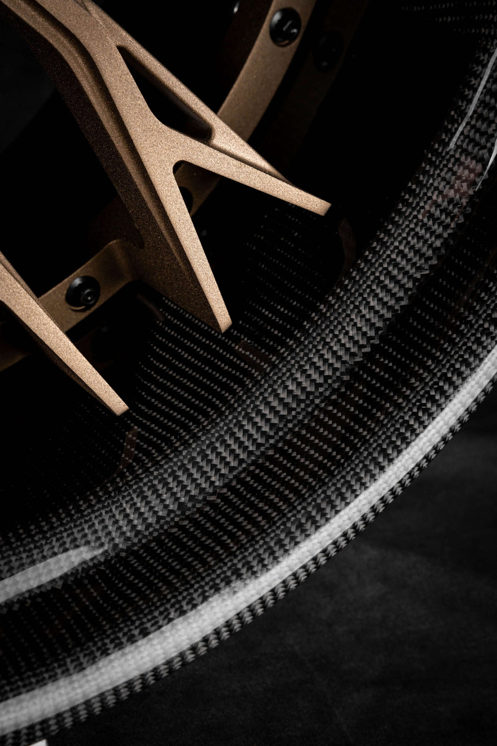 Close-up of a forged step lip wheel showcasing custom gold finish and intricate design for Corvette C8, featuring deep dish rims.