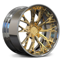 A polished gold and chrome multi-spoke alloy wheel rim, shown at a three-quarter angle on a clean white background.