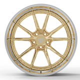 Custom gold and black 2-piece forged aftermarket Corvette wheel, RVRN FORGED DC05 Series rim, displayed in a polished finish.