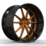 A multi-spoke alloy wheel rim with a glossy black outer barrel and a metallic bronze center and spokes, shown on a clean white background.