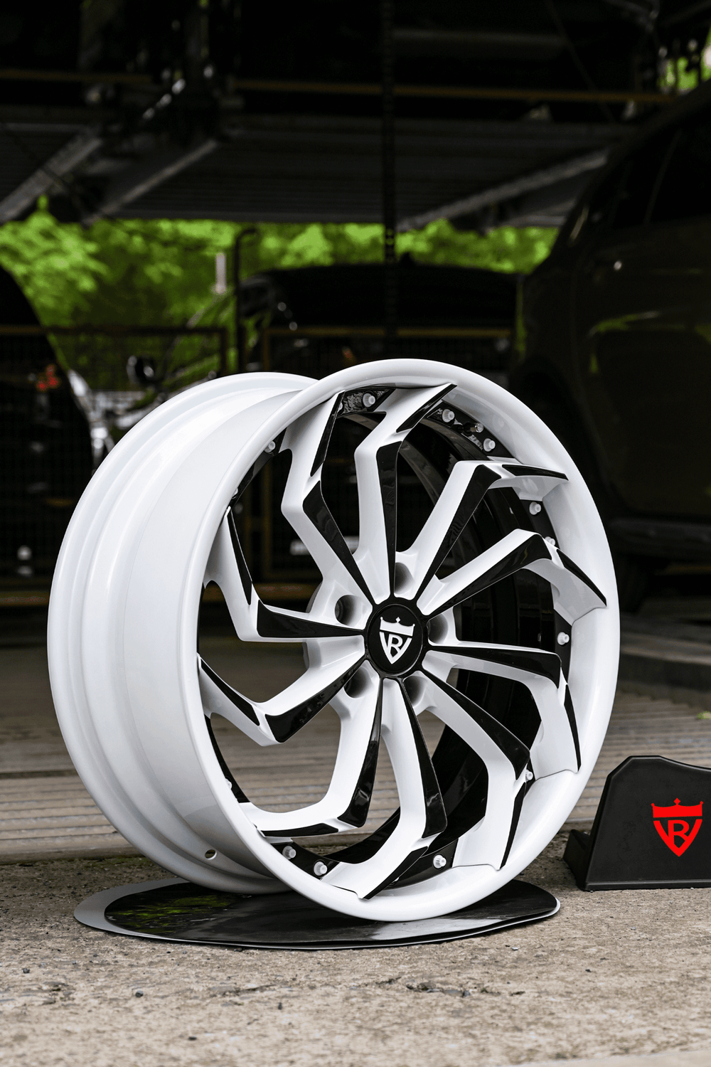 Custom forged Corvette C8 wheels showcasing striking white and black rims, perfect for enhancing vehicle aesthetics.
