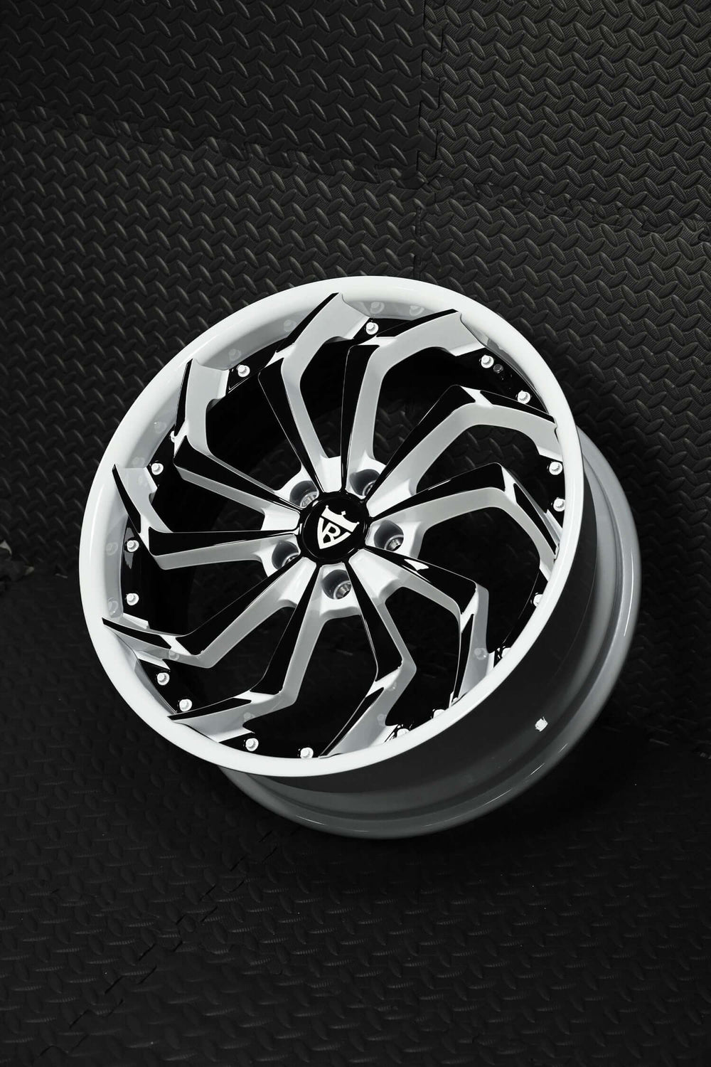Custom forged Corvette C8 wheels featuring striking white and black rims for enhanced style and performance.