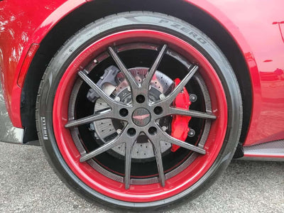 Aston Martin V8 Vantage featuring stylish RVRN wheels with carbon fiber rims and striking red accents.