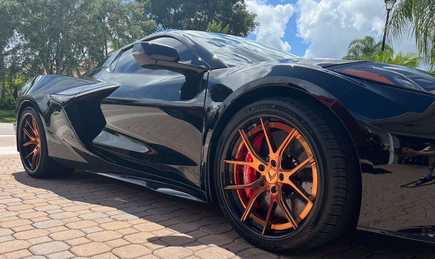 2025 Corvette C8 E-Ray rear angle showcasing 21x13 forged wheels and gloss black barrels