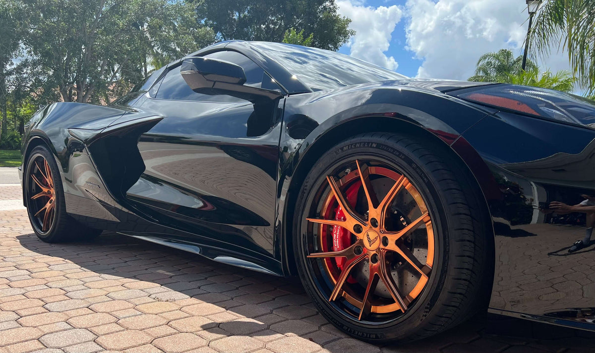 2025 Corvette C8 E-Ray rear angle showcasing 21x13 forged wheels and gloss black barrels