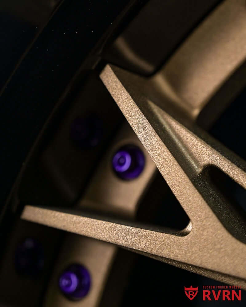 Close-up of custom 2-piece deep lip rims showcasing step lip forged wheels with stylish purple accents.