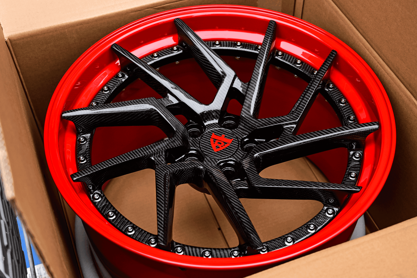 Custom carbon wheels for 2019 Ferrari 488 GTB in a red finish, showcasing sporty design and premium aftermarket quality.