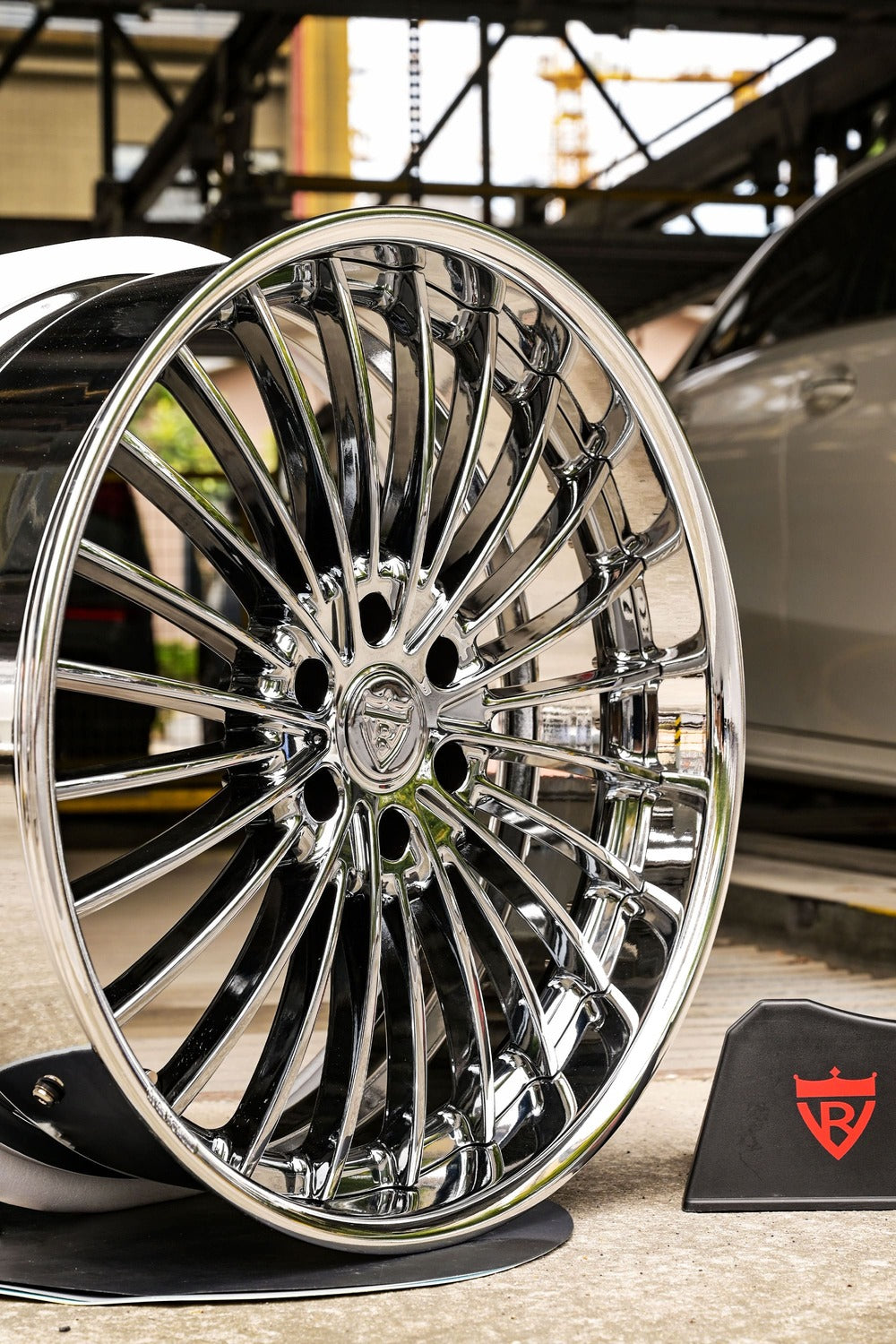 Custom forged GMC Yukon wheels in black chrome, showcasing intricate design and shine, perfect for truck enthusiasts.