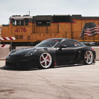 RVRN custom forged wheels RV-DP02 on a 2014 Porsche Cayman Widebody, 21inch staggered size, bespoke rims with 5 spoke and deep dish style 
