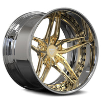 Gold and silver alloy wheel on a white background