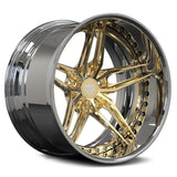 Gold and silver alloy wheel on a white background