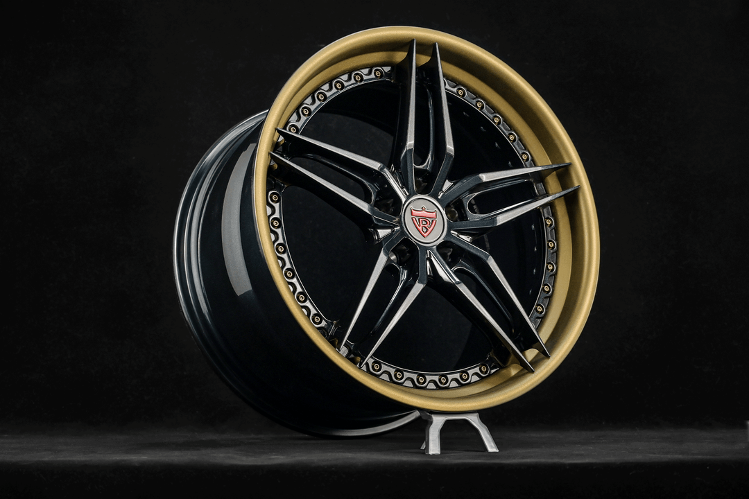 Custom forged Corvette C8 wheels showcasing striking 5 spoke rims with a unique gold and black design.