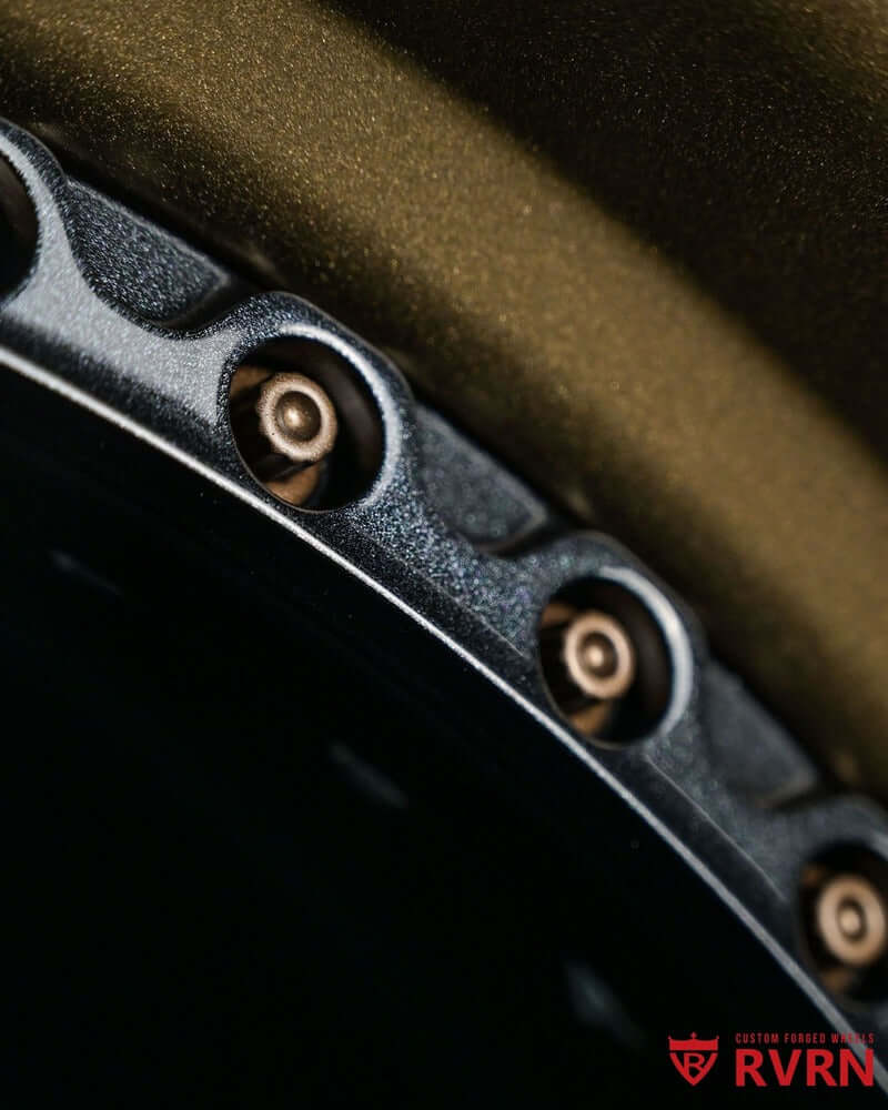 Close-up of custom forged Corvette C8 wheels showcasing intricate 5 spoke rims and detailing.
