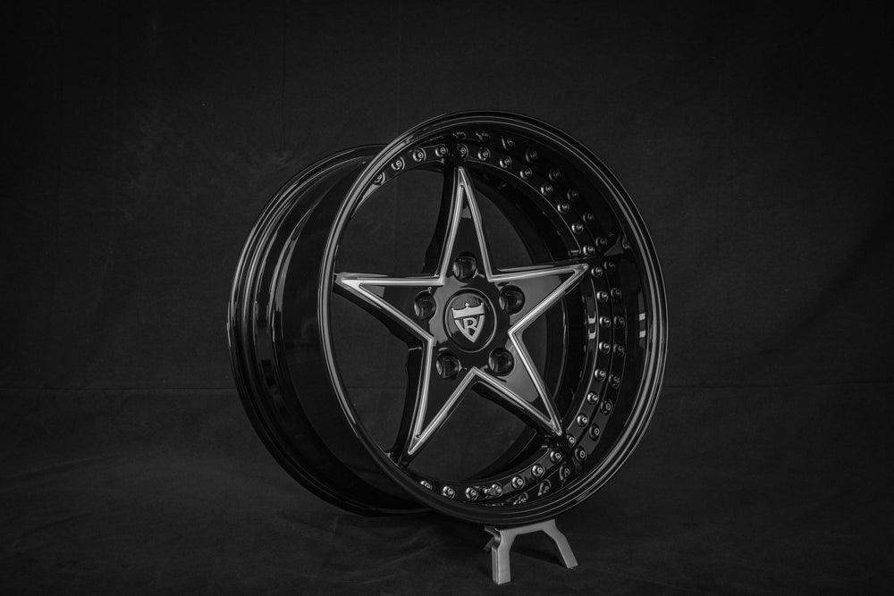Custom black star-shaped wheel designed for Jeep Wrangler, featuring 17-inch size and forged rim style.