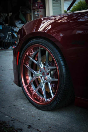 Close-up of RVRN RV-DR08 polished rose gold deep dish wheel on 2018 Dodge Charger Daytona front 22x9.5 fitment