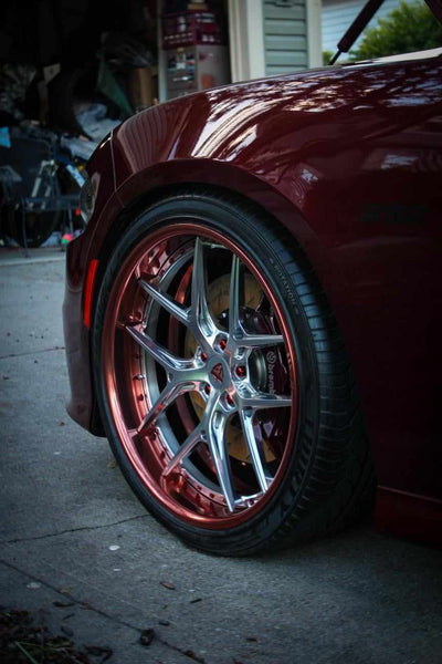 Close-up of RVRN RV-DR08 polished rose gold deep dish wheel on 2018 Dodge Charger Daytona front 22x9.5 fitment