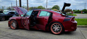 Detail shot RVRN RV-DR08 polished rose gold deep dish barrel and red hardware on Dodge Charger Daytona