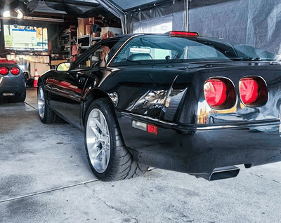 Low-angle front shot of Corvette C4 ZR1 on RVRN RV-DR08D wheels, brushed aluminum and chrome accent design.