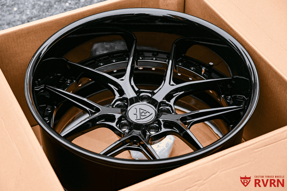 Dodge Challenger RV-DR08D forged deep dish wheel, glossy black finish, displayed inside a cardboard box.
