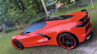 Sebring Orange Corvette C8 on black forged wheels aggressive stance