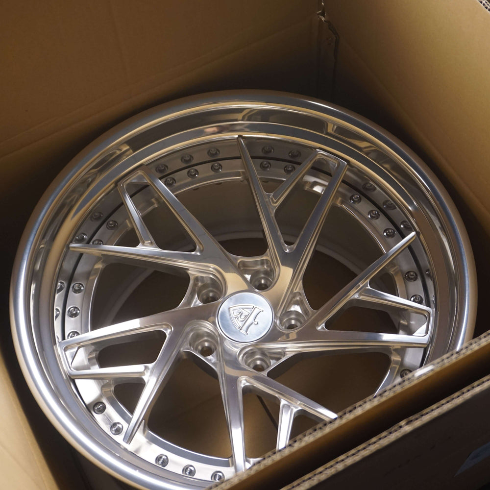 Brushed aluminum multi-spoke RVRN RV-T081 forged wheel in its shipping box, custom deep dish wheels for the 1984 Corvette C4