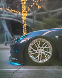 Front wheel close-up Tesla Model 3 RVRN forged 19x10 polished aluminum blue