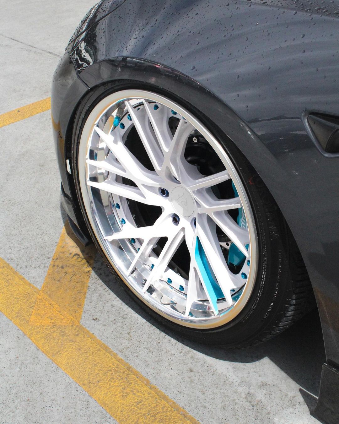 Rear angle Tesla Model 3 on RVRN RV-DT01 wheels deep polished aluminum blue 19x11 fitment