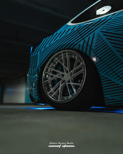 Rolling shot Tesla Model 3 on RVRN polished aluminum blue forged wheels RV-DT01