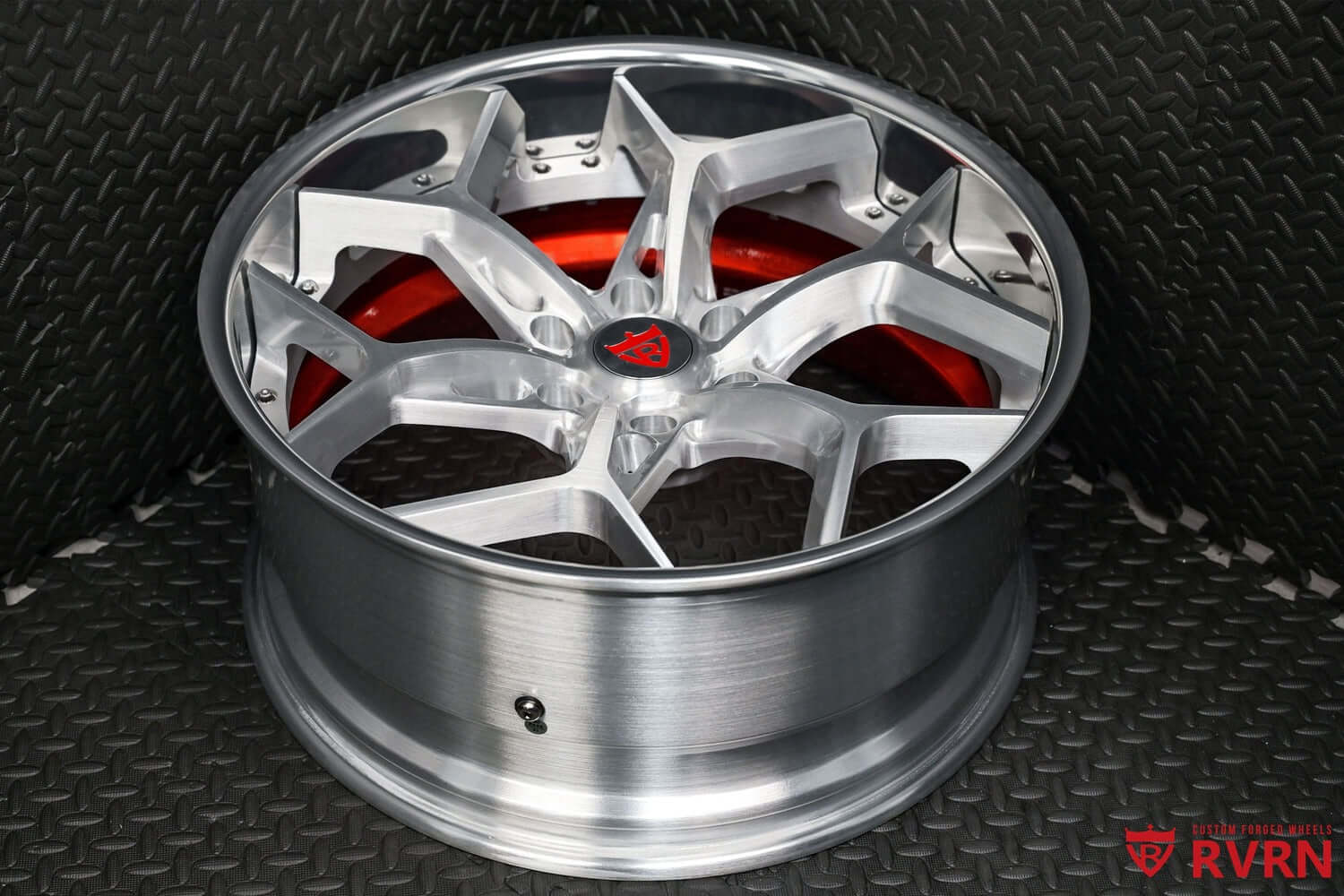 22 inch custom silver wheel for GMC Sierra, featuring a sleek design and truck forged rims on a textured background.