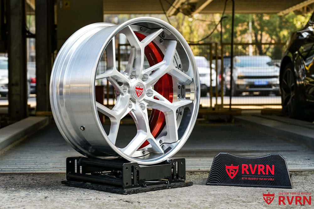 22 inch custom silver wheel for GMC Sierra showcasing truck forged rims on a display stand.