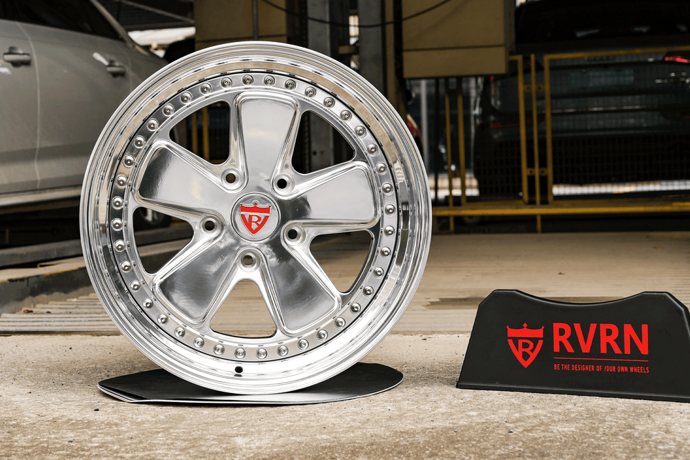 Classic 5 spoke deep custom forged 2-piece wheel for Volkswagen, showcasing polished design and strength in a garage setting.