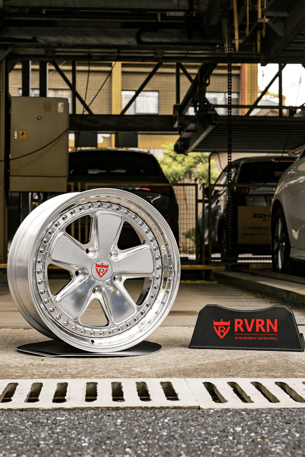 Classic 5 spoke deep custom forged 2-piece VW wheels displayed in a parking area, showcasing a polished finish.