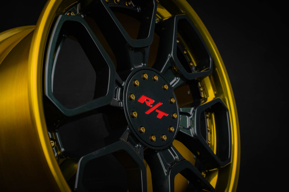 Close-up of black and gold Dakota RT wheels for Dodge Dakota with 6 lug design.