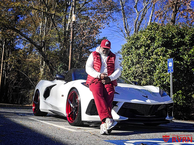 Close-up of MC35 20x9 front wheel on 2023 Corvette C8 Z51, gloss black with red mist accents