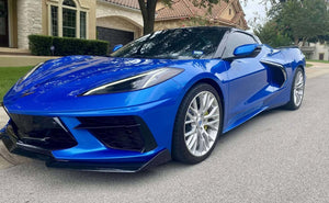Front view of a Riptide Blue 2024 Corvette C8 Stingray on RVRN RV-MC65 brushed aluminum custom forged wheels in a driveway