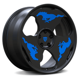 Custom forged monoblock wheel in black with blue Mustang logos, designed for Ford Mustang vehicles. Unique rim design.