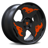 Custom forged monoblock wheel for Ford Mustang featuring unique orange pony designs on a sleek black finish.