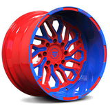 Custom forged monoblock deep dish wheel in red and blue, designed for Dodge Ram trucks, machined from aerospace-grade aluminum.