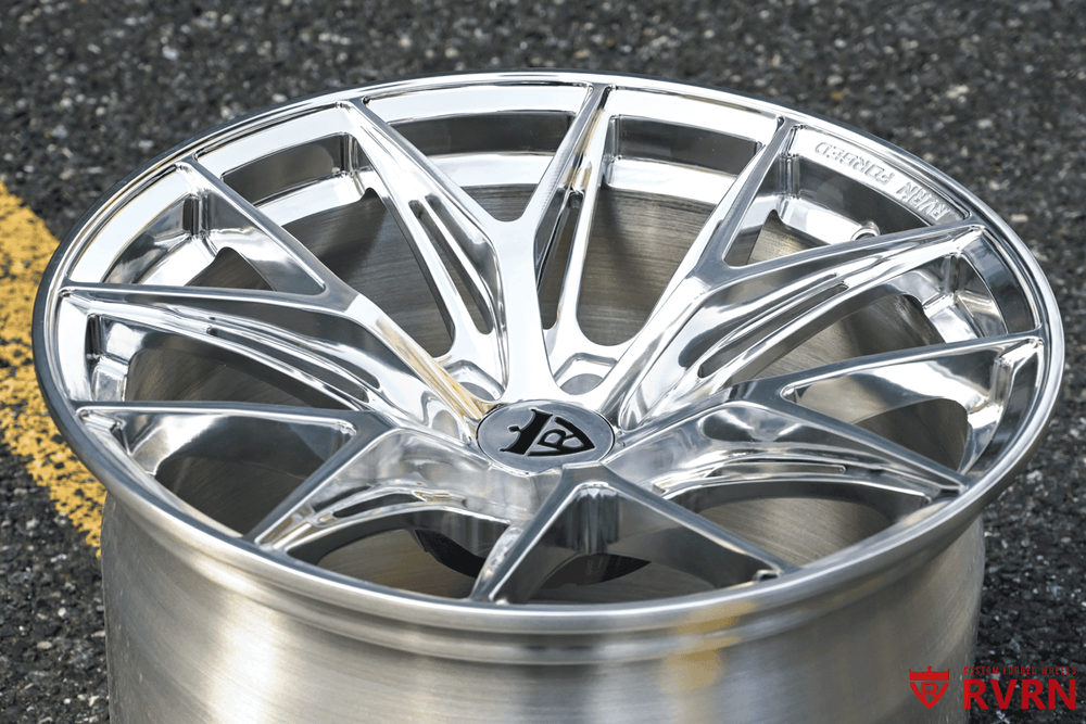 Polished aluminum mesh RVRN RV-MH051 forged wheel standing on the shop pavement, three-quarter view