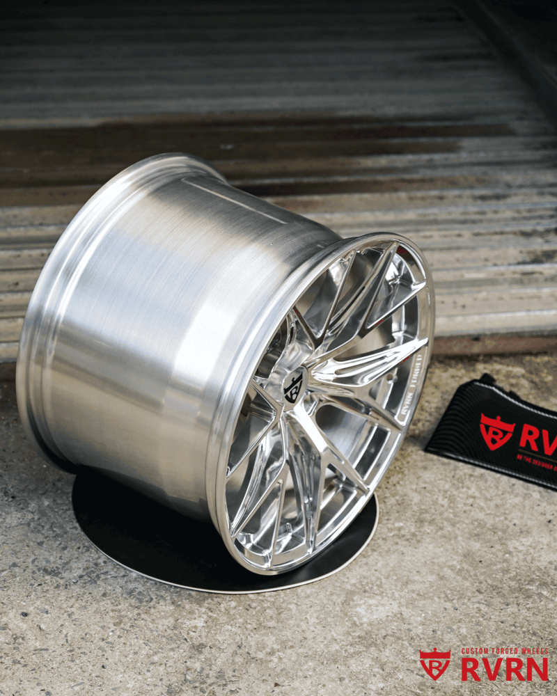 Angled view of the polished aluminum RVRN RV-MH051 forged wheel on the workshop floor, 1990 Dodge Viper RT/10 build