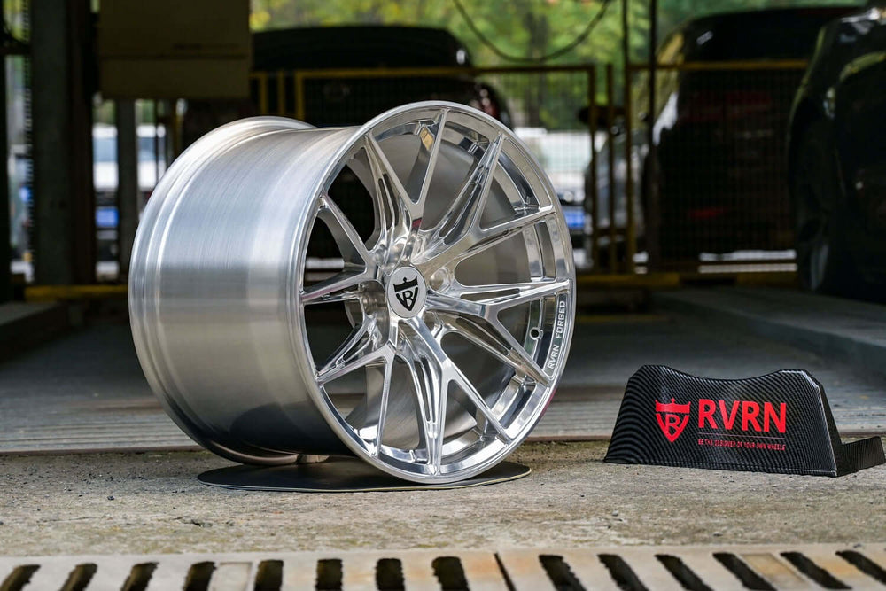 Polished aluminum RVRN RV-MH051 forged wheel on the shop floor beside the RVRN sign, 1990 Dodge Viper RT/10