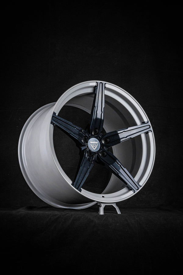Custom Corvette C8 concave wheel in monoblock design with forged rims displayed on a dark background.