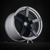 Sleek black and silver monoblock rim for Corvette C8, showcasing custom forged concave design for enhanced performance and style.