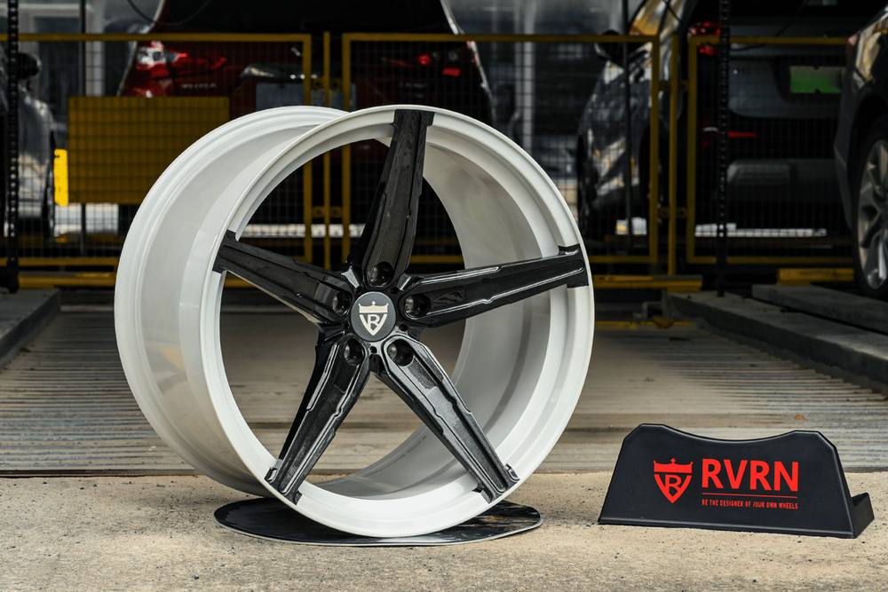 Gloss black five-spoke RVRN RV-MJ201 forged wheel with a polished step lip on the shop floor, custom wheels for the 2023 Corvette C8 Z06
