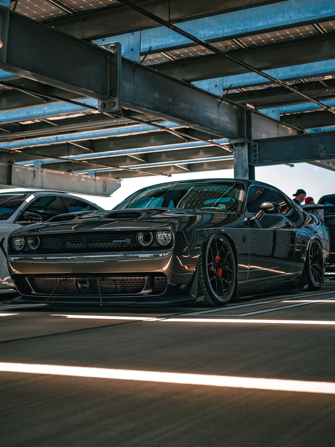 2023 Dodge Challenger Hellcat with concave 20-inch staggered custom forged rvrn wheels showcased under parking structure.