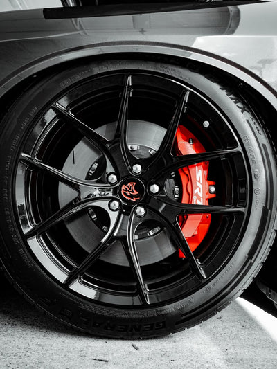 Close-up of 2023 Dodge Challenger Hellcat custom forged 20-inch staggered wheels with concave rims.
