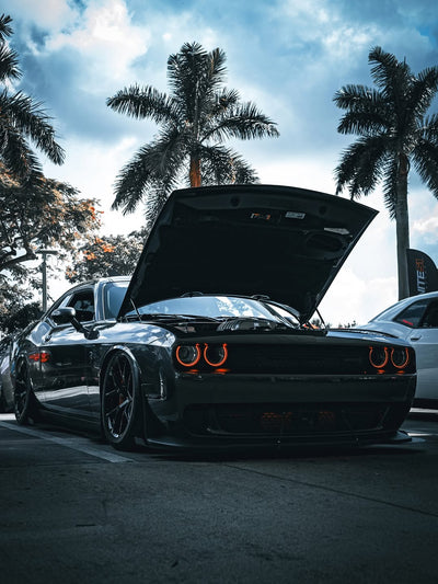 2023 Dodge Challenger Hellcat with concave rims and 20-inch staggered wheels showcased outdoors.