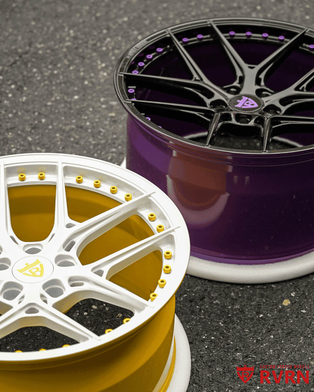Close-up of custom Ford Mustang wheels: white and yellow 19-inch staggered rims with a sleek design.